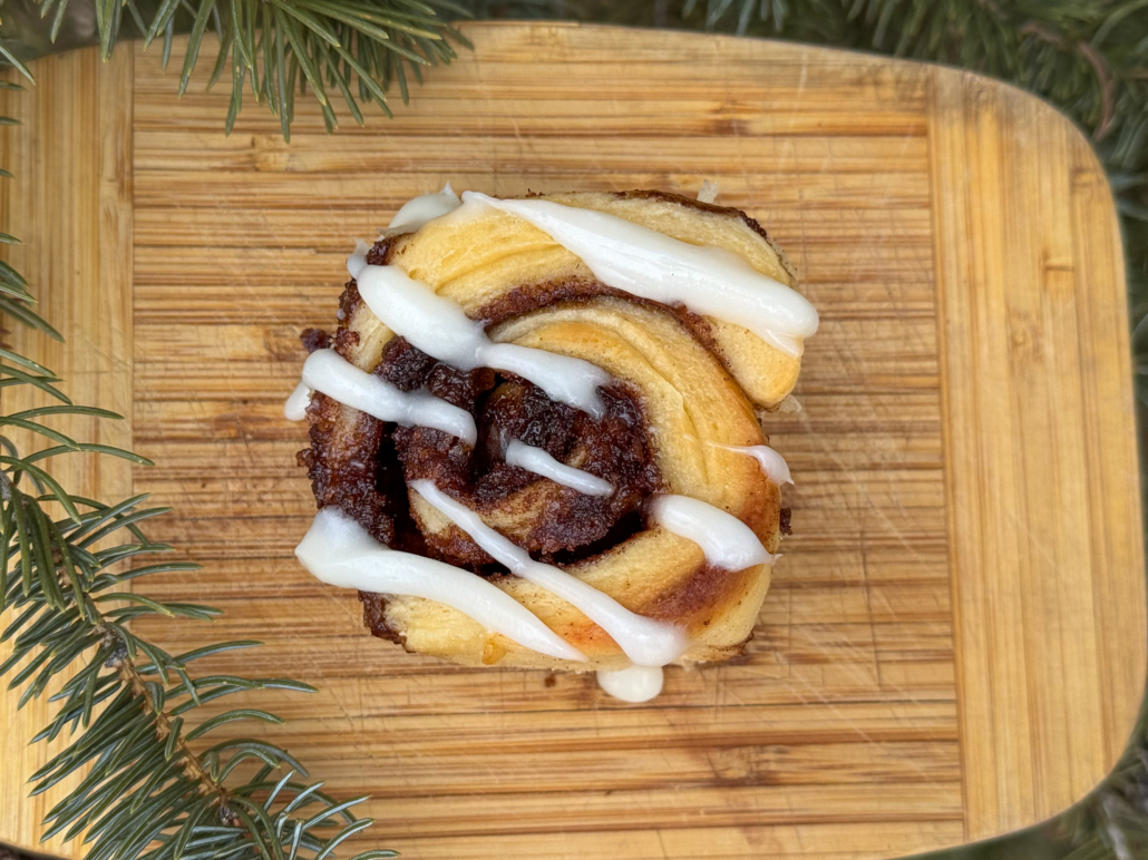 Cinnamon roll with cream cheese frosting.