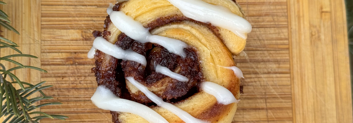 Cinnamon roll with cream cheese frosting.