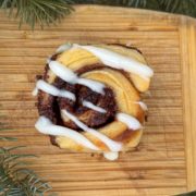 Cinnamon roll with cream cheese frosting.