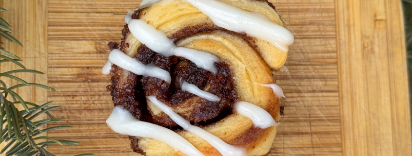 Cinnamon roll with cream cheese frosting.