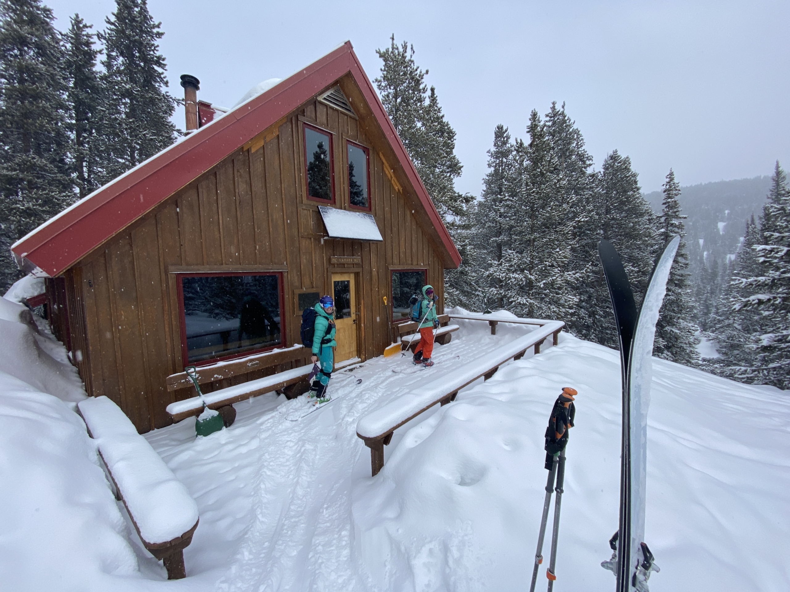 A group of backcountry skiers and splitboarders returning to the McNamara Hut outside of Aspen, Colorado.